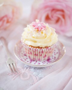 Frosted Cupcake with pink fondant flowers and roses